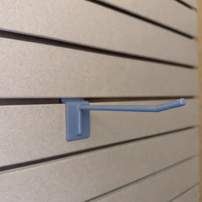 Ironleaf 6″ slatwall hook heavy duty reinforced polymer installed on slatwall panel for secure display.