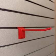 Ironleaf 6″ slatwall hook heavy duty reinforced polymer mounted on slatwall panel for secure displays.
