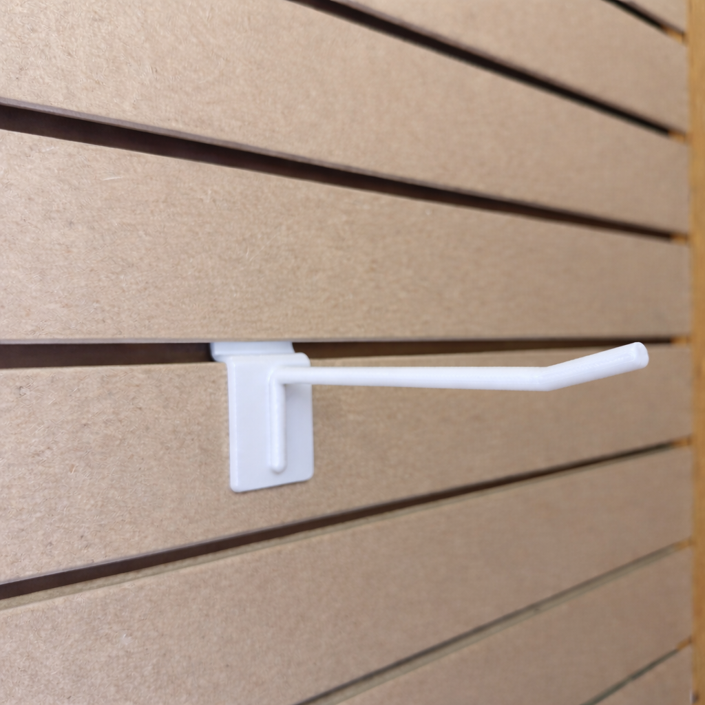 Ironleaf 6" slatwall hook heavy duty reinforced polymer mounted on slatwall panels for displaying products.