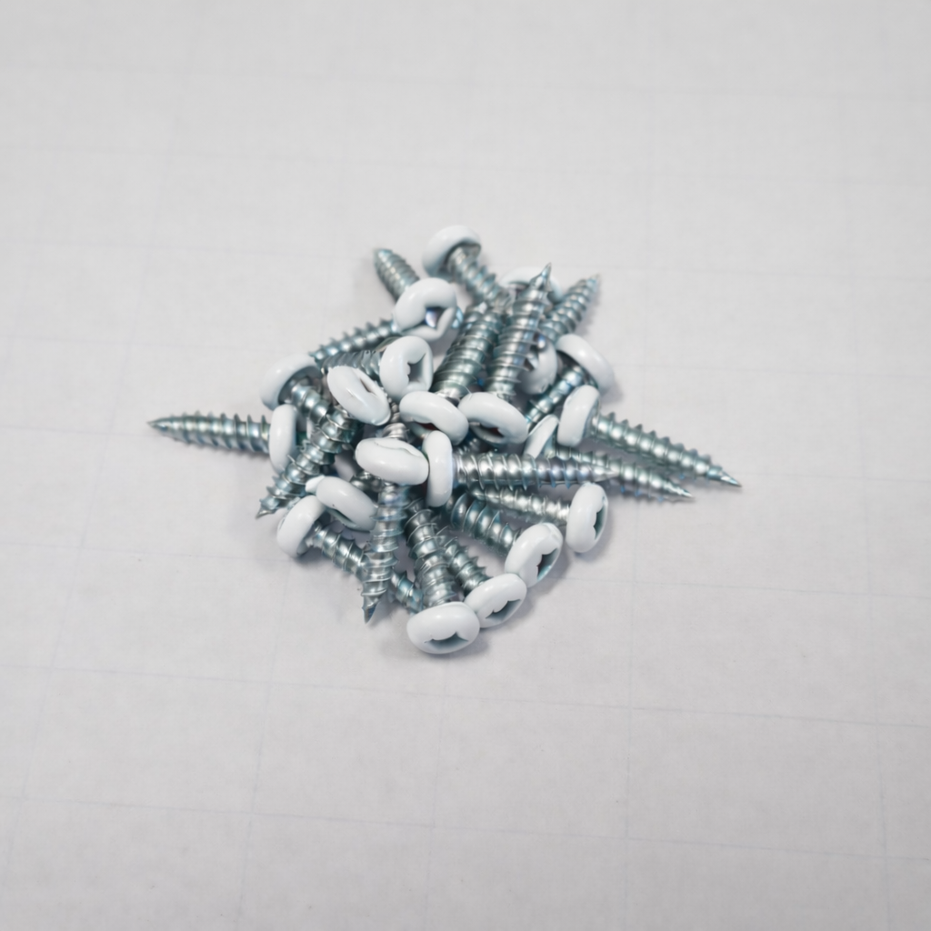 Color matched pan head screws robertson drive in a pile on a gray background, ideal for slatwall panel installation.